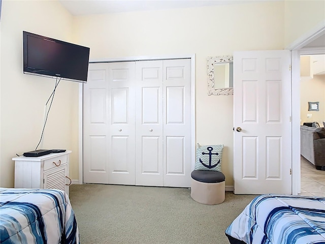 116 Westport Ln, Davenport, FL 33896 - bedroom featuring light carpet, a closet, and baseboards