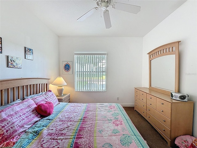 107 Amaca Ln, Davenport, FL 33897 - bedroom with dark carpet and a ceiling fan