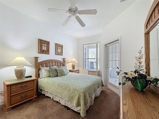 107 Amaca Ln, Davenport, FL 33897 - bedroom featuring dark carpet, access to exterior, a ceiling fan, and a textured ceiling