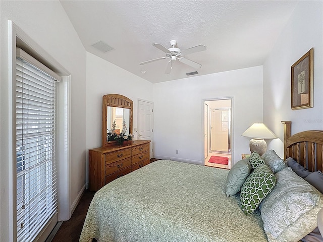 107 Amaca Ln, Davenport, FL 33897 - bedroom with multiple windows, ceiling fan, and ensuite bathroom