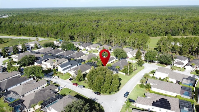 107 Amaca Ln, Davenport, FL 33897 - aerial overview of property's location featuring a heavily wooded area and nearby suburban area