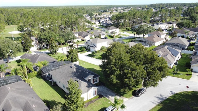 107 Amaca Ln, Davenport, FL 33897 - aerial view of property's location with nearby suburban area and a heavily wooded area