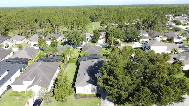 107 Amaca Ln, Davenport, FL 33897 - aerial overview of property's location featuring a forest and nearby suburban area
