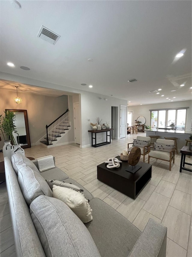 8919 Lakeshore Pointe Dr, Winter Garden, FL 34787 - living room with stairway and recessed lighting