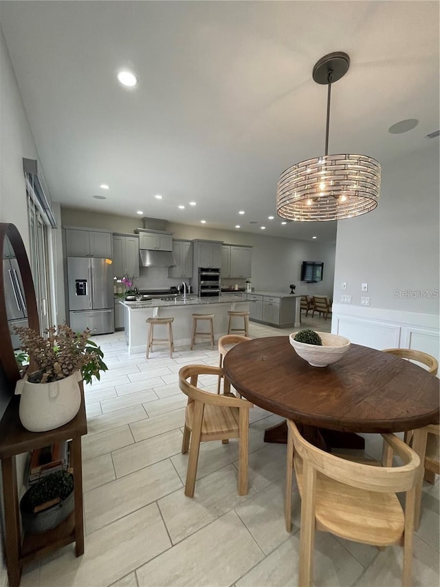 8919 Lakeshore Pointe Dr, Winter Garden, FL 34787 - dining area with recessed lighting and wainscoting