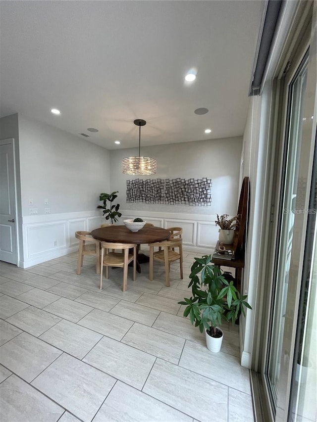 8919 Lakeshore Pointe Dr, Winter Garden, FL 34787 - dining room with a decorative wall, recessed lighting, a chandelier, and wainscoting