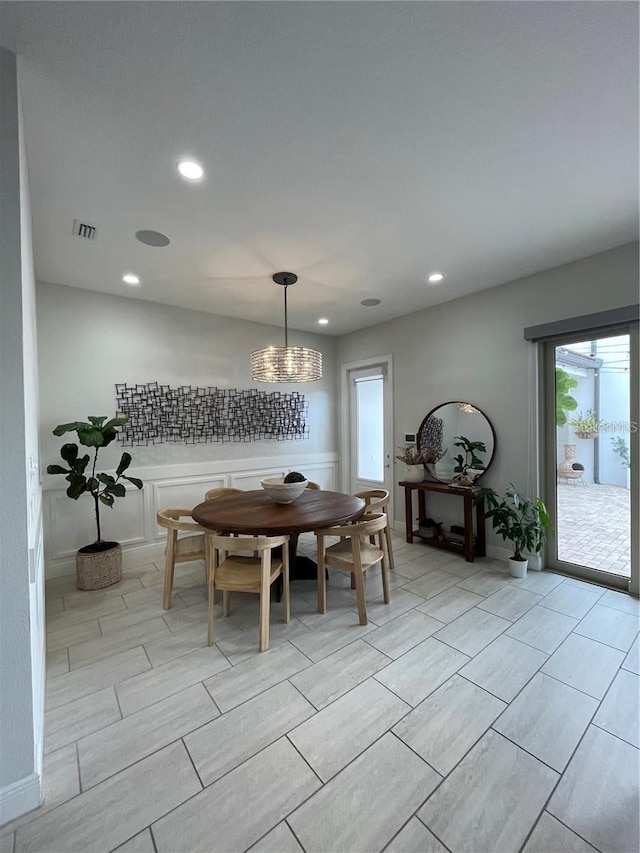 8919 Lakeshore Pointe Dr, Winter Garden, FL 34787 - dining area featuring recessed lighting, a chandelier, and wood tiled floors