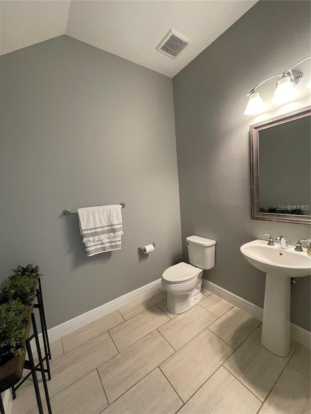 8919 Lakeshore Pointe Dr, Winter Garden, FL 34787 - bathroom with toilet and lofted ceiling