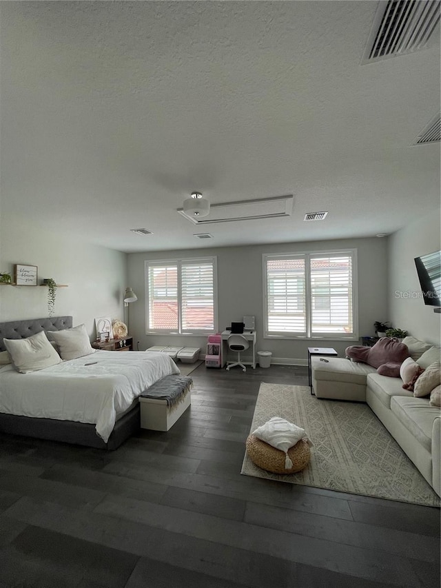 8919 Lakeshore Pointe Dr, Winter Garden, FL 34787 - bedroom featuring wood finished floors and a textured ceiling