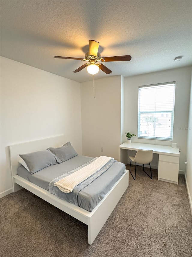 4736 Tribute Trl, Kissimmee, FL 34746 - carpeted bedroom featuring a textured ceiling, an office area, ceiling fan, and baseboards