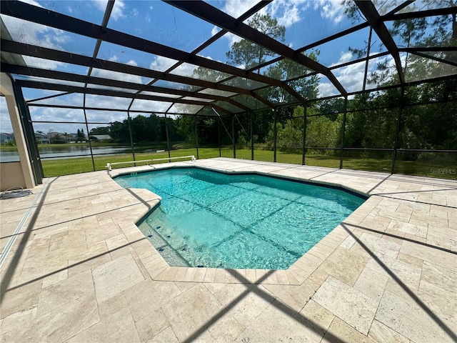 2356 Chadwick Cir, Kissimmee, FL 34746 - swimming pool with a patio, a water view, glass enclosure, and a yard