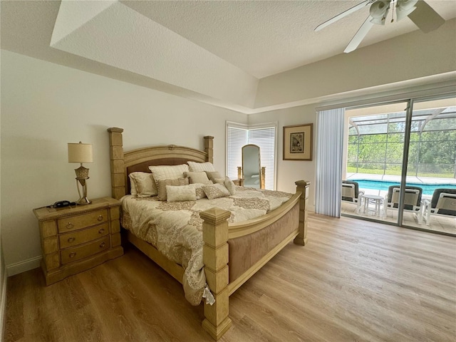 2356 Chadwick Cir, Kissimmee, FL 34746 - bedroom with access to exterior, wood finished floors, a textured ceiling, and a ceiling fan