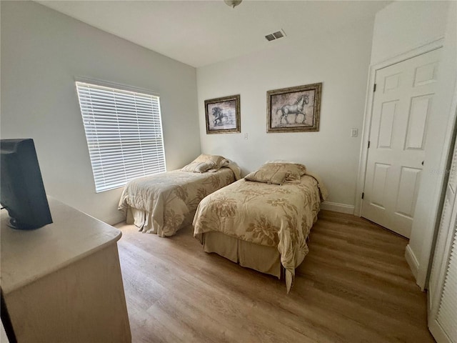 2356 Chadwick Cir, Kissimmee, FL 34746 - bedroom featuring wood finished floors and baseboards