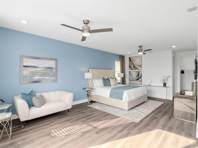 7802 Palmilla Ct, Reunion, FL 34747 - bedroom with wood finished floors, recessed lighting, baseboards, and ceiling fan