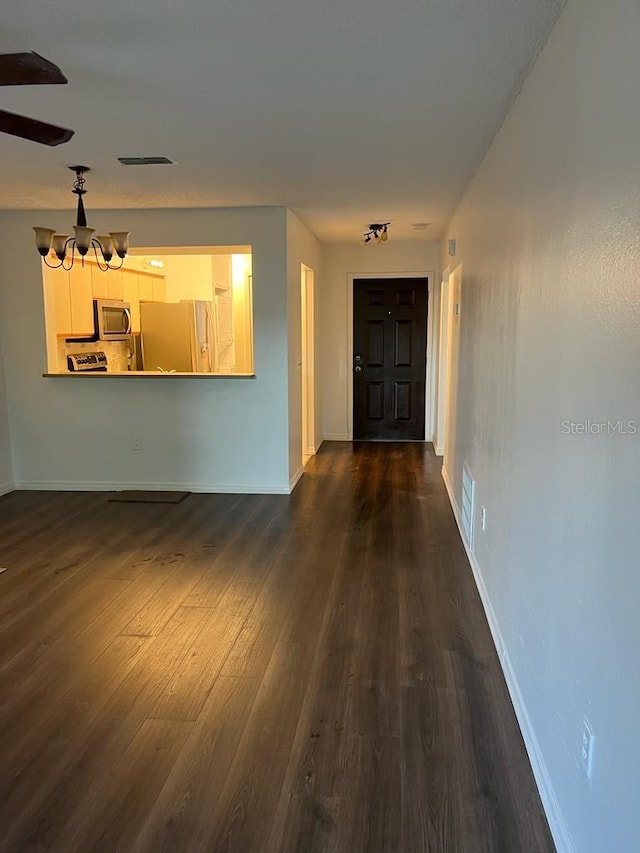 2900 S Semoran Blvd Unit 1, Orlando, FL 32822 - unfurnished living room with dark wood-style flooring and baseboards