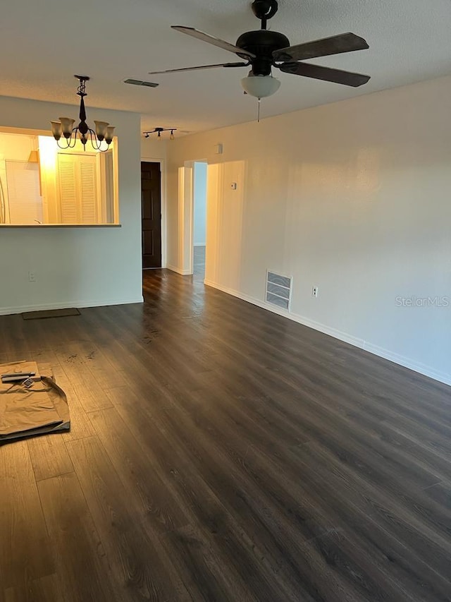 2900 S Semoran Blvd Unit 1, Orlando, FL 32822 - unfurnished living room featuring ceiling fan, dark wood-style floors, a chandelier, and baseboards