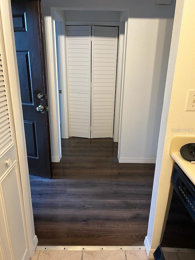 2900 S Semoran Blvd Unit 1, Orlando, FL 32822 - hallway with dark wood-style floors and baseboards