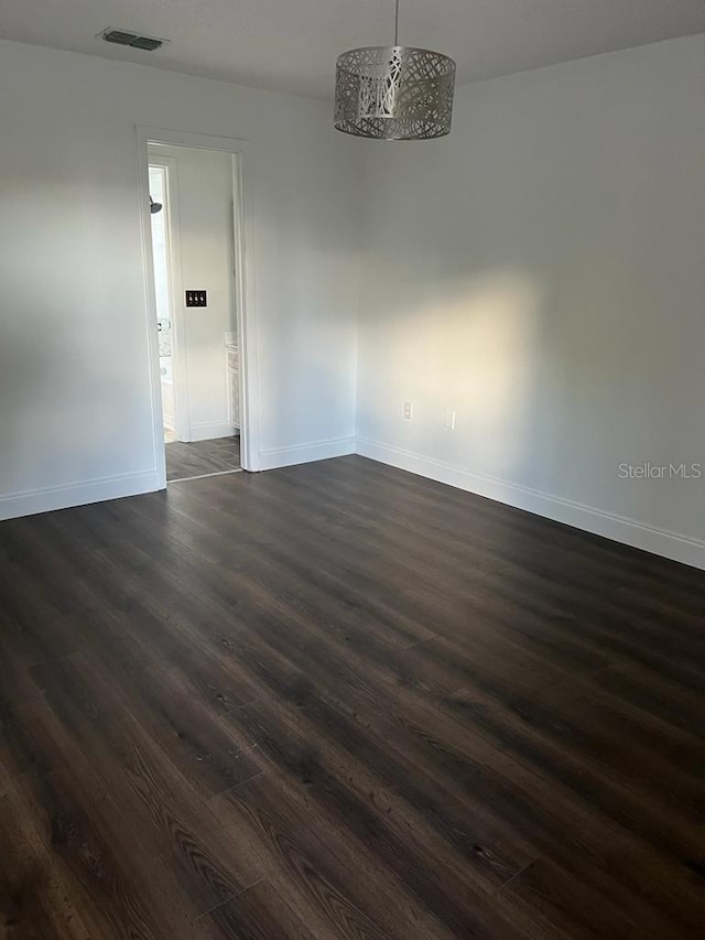 2900 S Semoran Blvd Unit 1, Orlando, FL 32822 - empty room with dark wood-style floors and baseboards