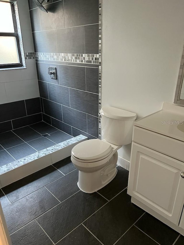 2900 S Semoran Blvd Unit 1, Orlando, FL 32822 - full bathroom featuring a stall shower, toilet, vanity, and tile patterned floors