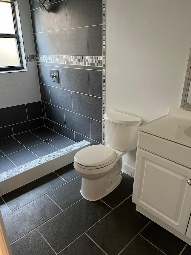 2900 S Semoran Blvd Unit 1, Orlando, FL 32822 - bathroom with toilet, a shower stall, vanity, and tile patterned flooring