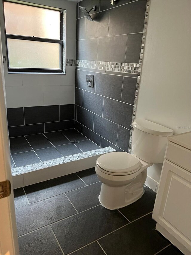 2900 S Semoran Blvd Unit 1, Orlando, FL 32822 - bathroom featuring toilet, a shower stall, and tile patterned flooring