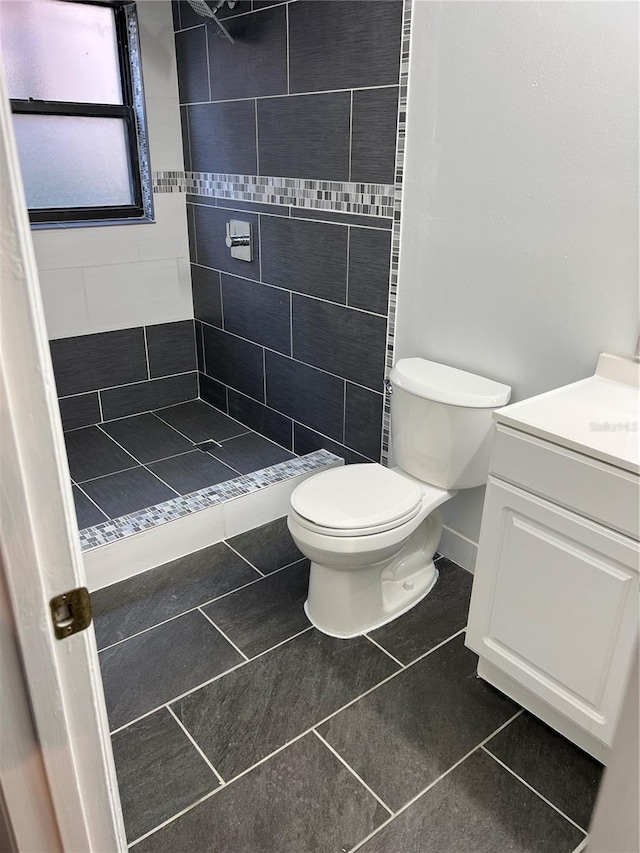 2900 S Semoran Blvd Unit 1, Orlando, FL 32822 - bathroom with a shower stall, tile patterned floors, toilet, vanity, and baseboards