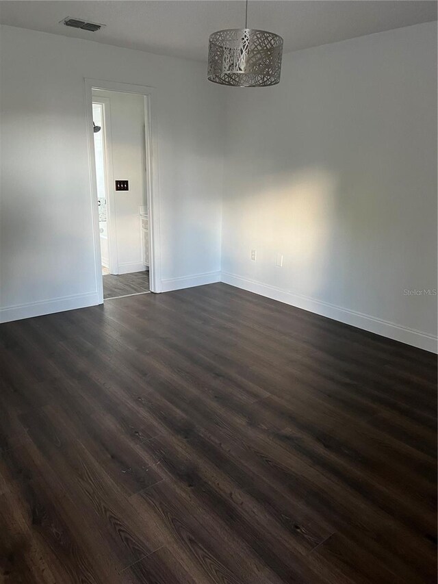 2900 S Semoran Blvd Unit 1, Orlando, FL 32822 - unfurnished room featuring dark wood-type flooring and baseboards