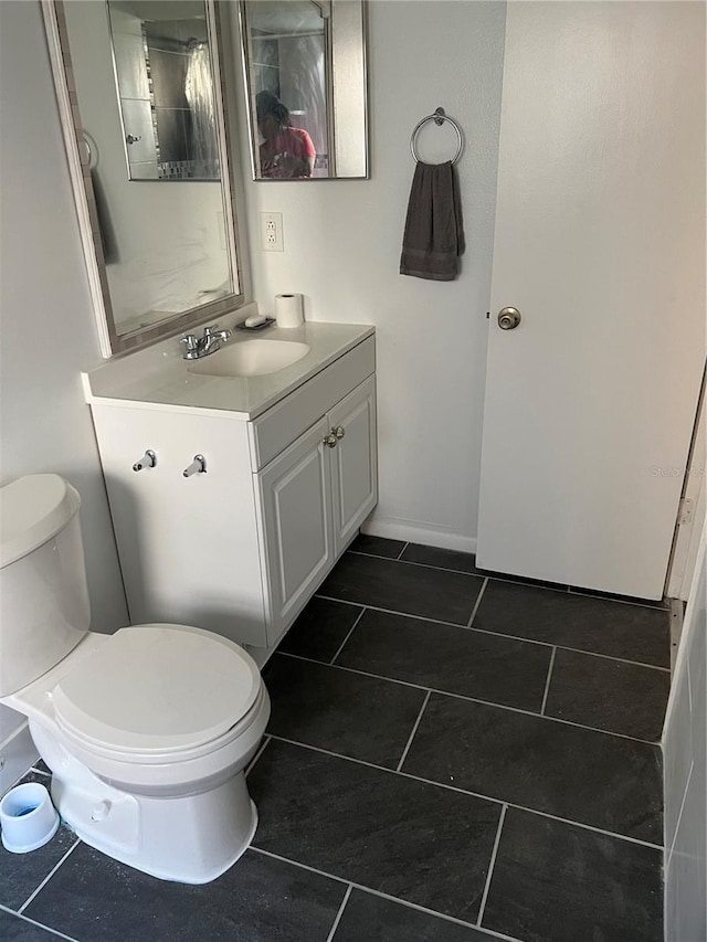 2900 S Semoran Blvd Unit 1, Orlando, FL 32822 - bathroom featuring toilet, vanity, and tile patterned flooring