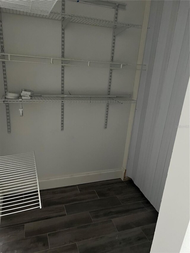 2900 S Semoran Blvd Unit 1, Orlando, FL 32822 - spacious closet featuring dark wood-type flooring