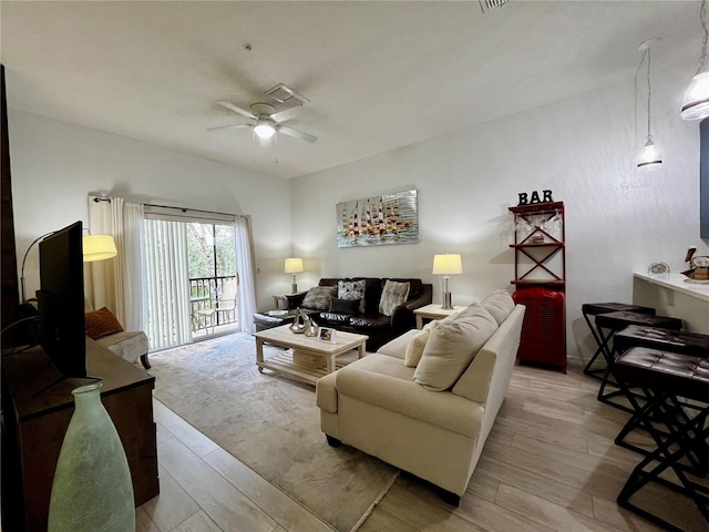 1106 Gran Bahama Blvd Unit 1106, Davenport, FL 33897 - living area featuring a ceiling fan and light wood finished floors