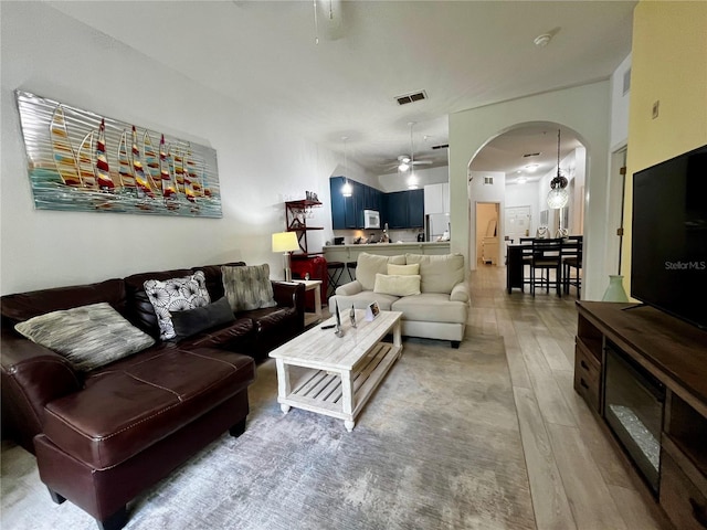 1106 Gran Bahama Blvd Unit 1106, Davenport, FL 33897 - living area with ceiling fan, wood finished floors, and arched walkways