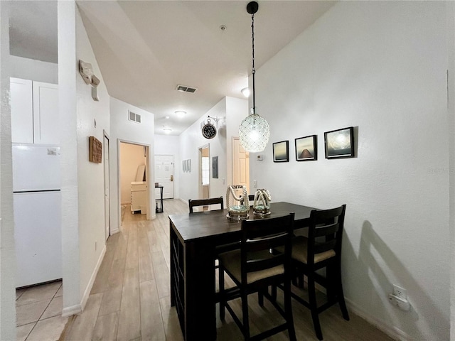 1106 Gran Bahama Blvd Unit 1106, Davenport, FL 33897 - dining room featuring light wood-style floors and baseboards