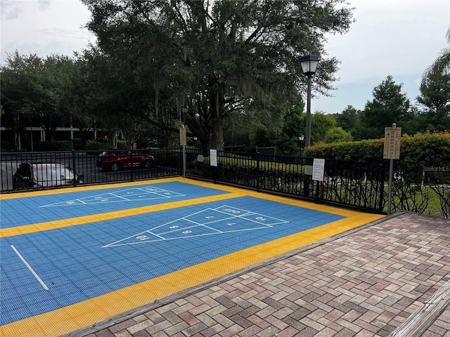 1106 Gran Bahama Blvd Unit 1106, Davenport, FL 33897 - surrounding community with shuffleboard and uncovered parking