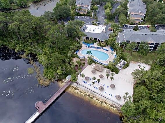 1106 Gran Bahama Blvd Unit 1106, Davenport, FL 33897 - aerial view of property and surrounding area featuring a large body of water and a pool area