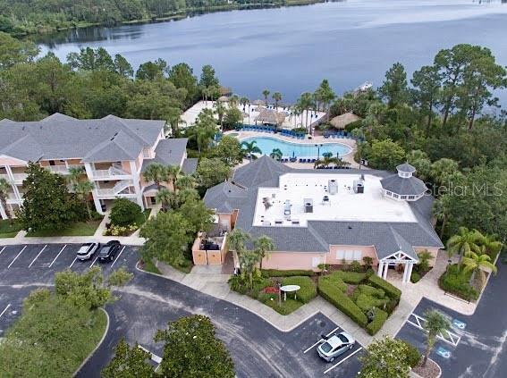 1106 Gran Bahama Blvd Unit 1106, Davenport, FL 33897 - aerial overview of property's location featuring a pool and a nearby body of water
