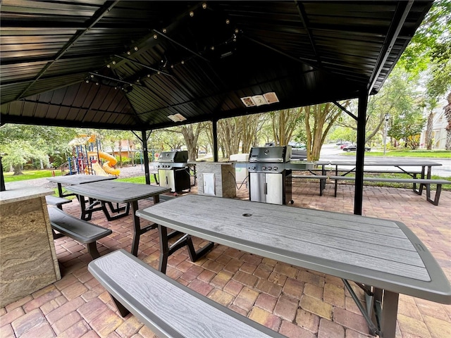1106 Gran Bahama Blvd Unit 1106, Davenport, FL 33897 - view of patio with a playground and area for grilling