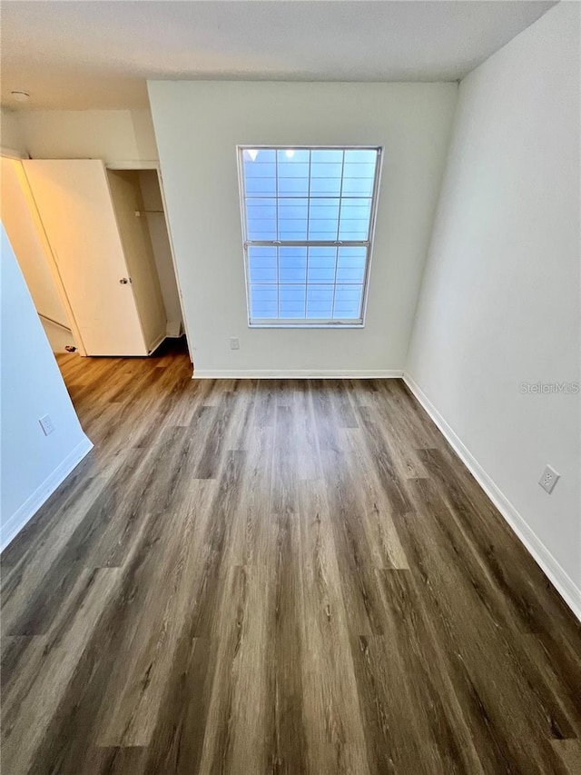 658 Caribbean Dr, Davenport, FL 33897 - spare room with dark wood finished floors and baseboards
