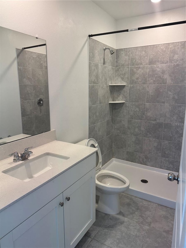 553 SE Turtle, Haines City, FL 33844 - bathroom featuring vanity, tiled shower, and tile patterned floors
