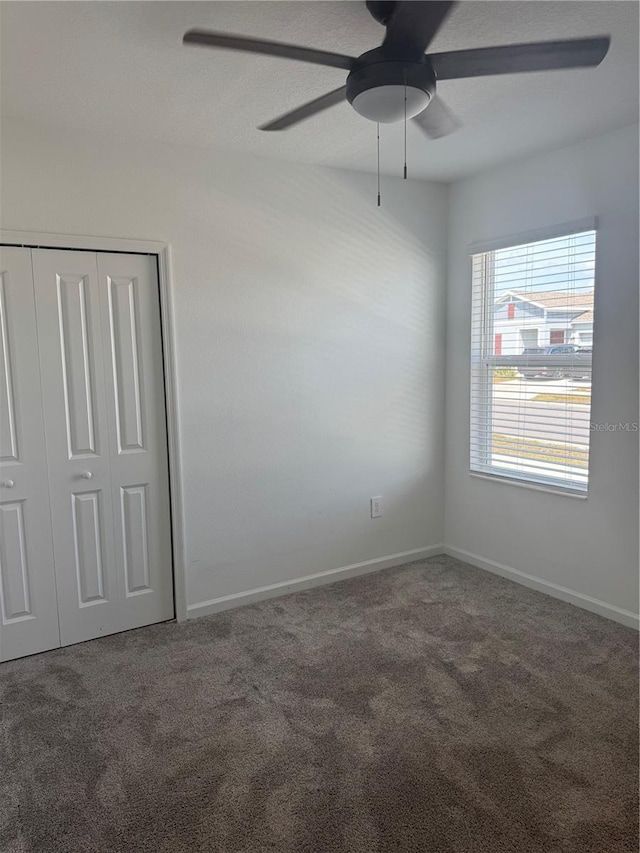 553 SE Turtle, Haines City, FL 33844 - carpeted empty room with a ceiling fan and baseboards