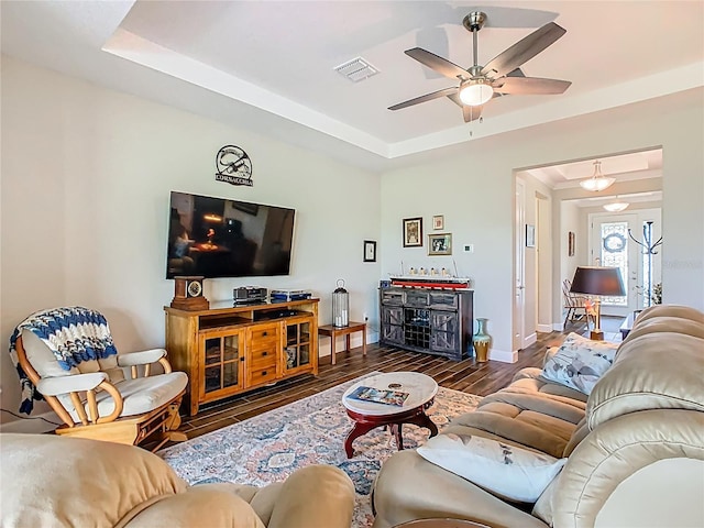 605 San Augusto Dr, Kissimmee, FL 34759 - living area featuring a tray ceiling, a ceiling fan, and wood finished floors