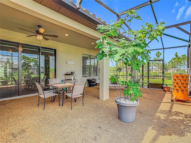 605 San Augusto Dr, Kissimmee, FL 34759 - view of patio / terrace with a lanai, a ceiling fan, and outdoor dining space