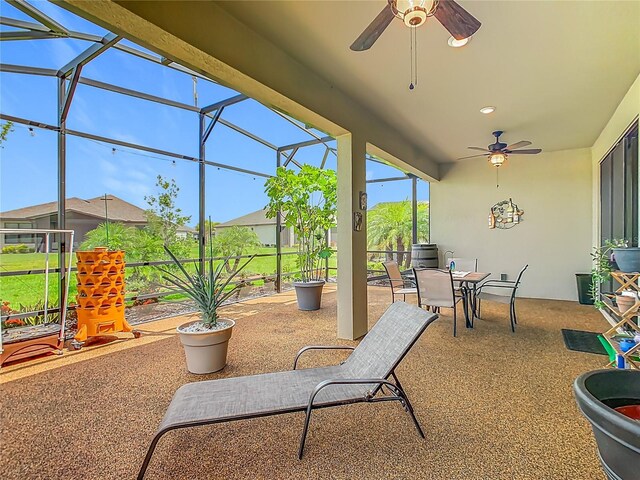 605 San Augusto Dr, Kissimmee, FL 34759 - view of patio / terrace with a ceiling fan, a lanai, and outdoor dining area
