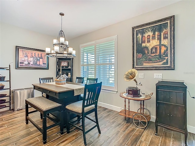 605 San Augusto Dr, Kissimmee, FL 34759 - dining area featuring wood finished floors and a chandelier