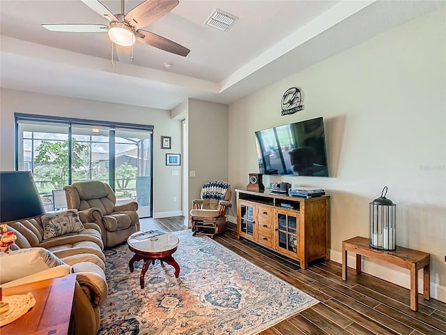 605 San Augusto Dr, Kissimmee, FL 34759 - living room featuring wood finished floors, a ceiling fan, and a tray ceiling