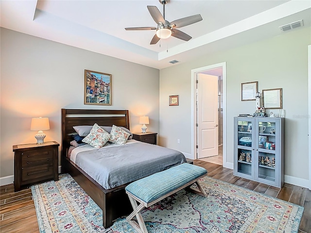 605 San Augusto Dr, Kissimmee, FL 34759 - bedroom with a tray ceiling, wood finished floors, and ceiling fan