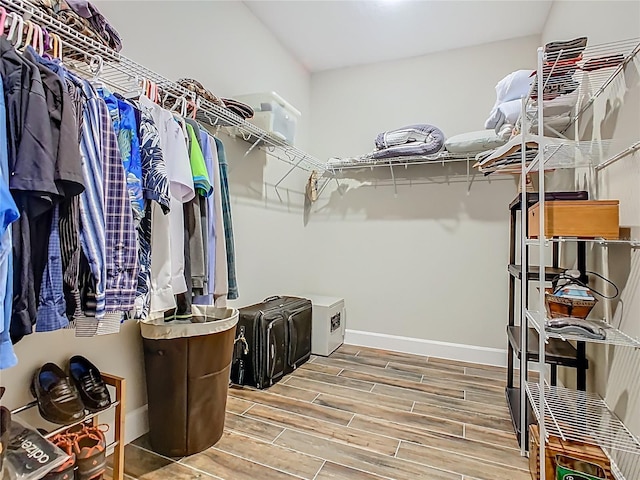 605 San Augusto Dr, Kissimmee, FL 34759 - walk in closet featuring wood tiled floors