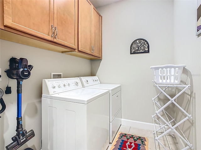 605 San Augusto Dr, Kissimmee, FL 34759 - washroom with washer and dryer, cabinet space, and light tile patterned floors