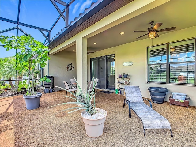 605 San Augusto Dr, Kissimmee, FL 34759 - view of patio featuring a ceiling fan and glass enclosure