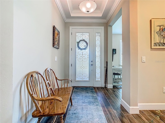 605 San Augusto Dr, Kissimmee, FL 34759 - foyer entrance featuring dark wood-type flooring, a tray ceiling, and ornamental molding