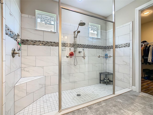 605 San Augusto Dr, Kissimmee, FL 34759 - bathroom with tiled shower and a walk in closet